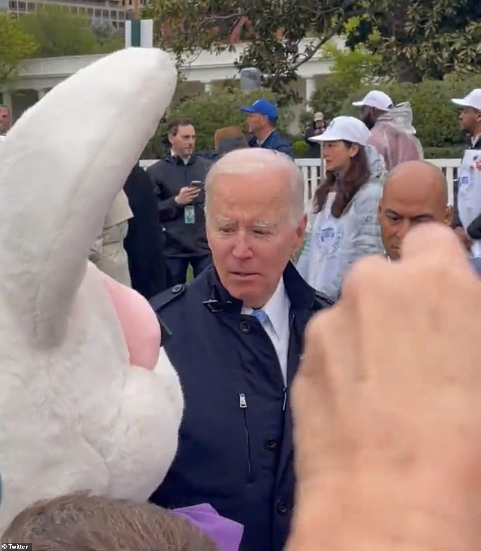 56756605-10729371-Biden_looks_confused_at_first_and_then_walks_away_as_the_Bunny_w-a-21_165031...jpg