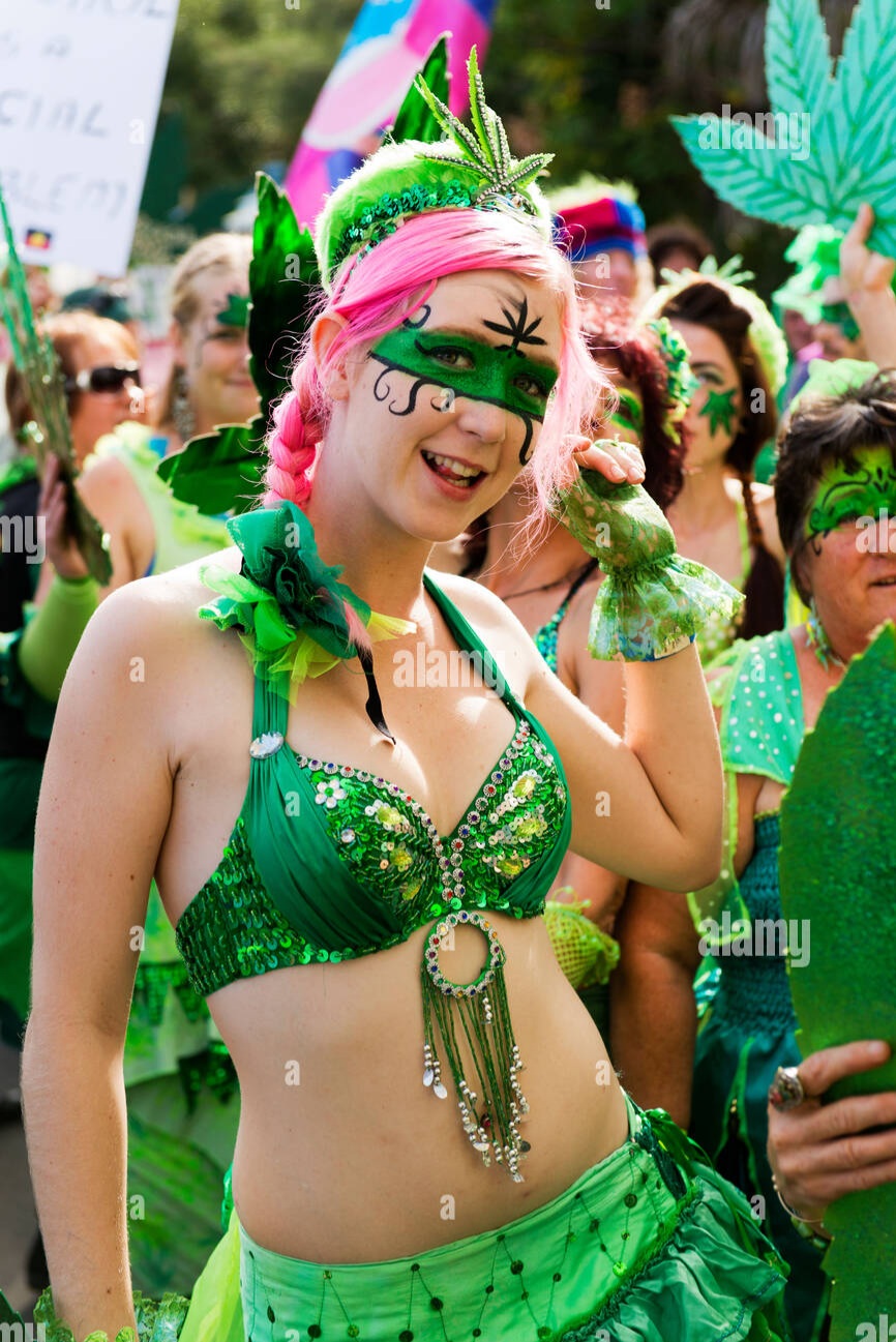 a-young-woman-dressed-as-a-ganja-faery-dances-in-the-mardi-grass-parade-DGYPX0.jpg