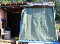 Outdoor dark shed with the triple layer tarp down.jpg